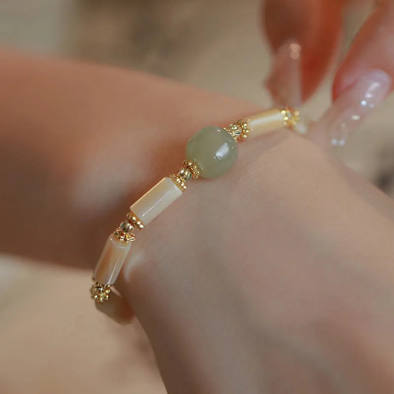 Natural Hetian Jade white lip shell bracelet for women with round beads and geometric design