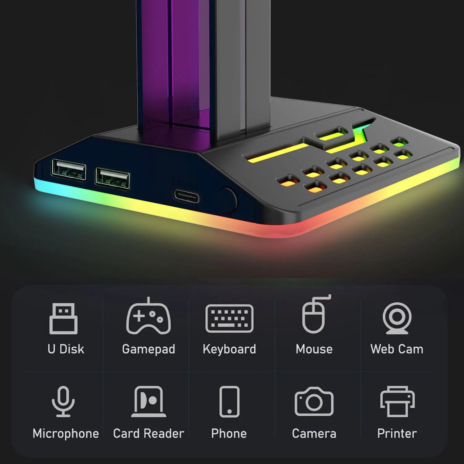 RGB colour-changing headphone display bracket with integrated dual USB ports on a desk.