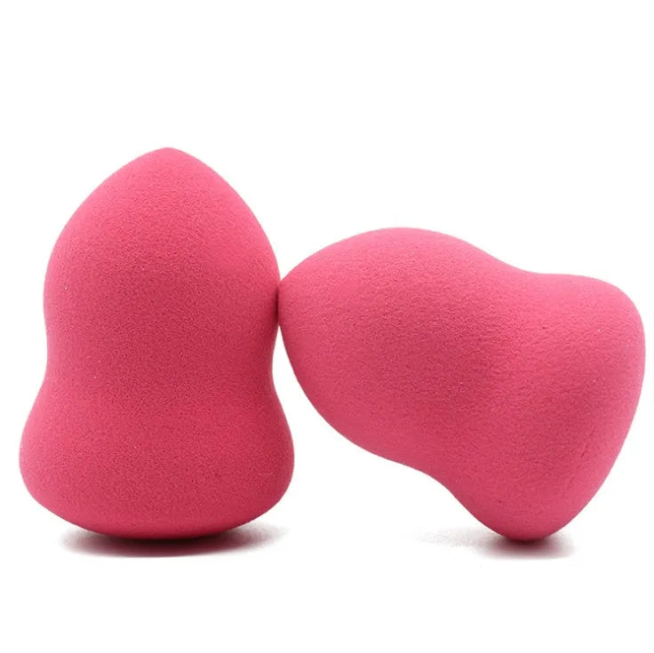 Pink hydrophilic non-latex makeup foundation sponge puff on white background.