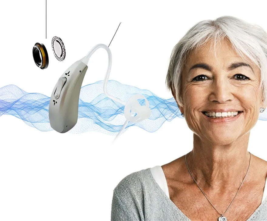 Invisible wireless hearing aid and its USB charging case on a table.