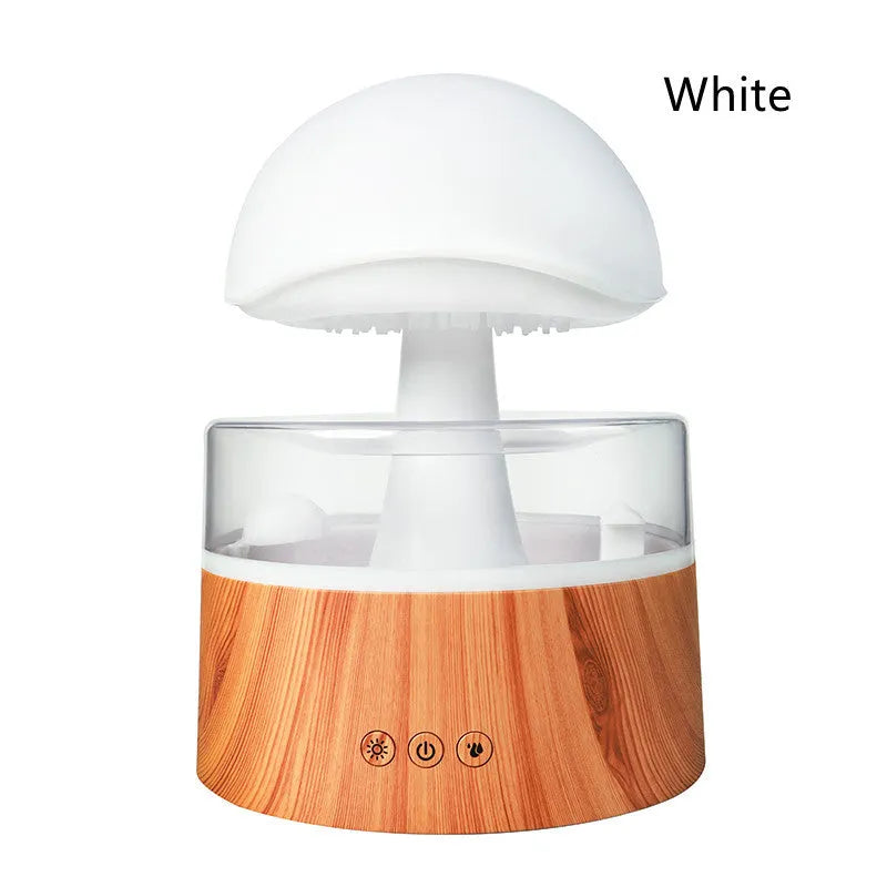 White cloud rain humidifier with rainfall simulation and LED lighting on wooden surface