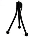 Small black iron mini tripod with ball head and folded legs on a table