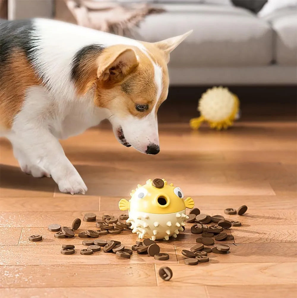Fish-shaped interactive dog toy with treat dispensing opening and textured surface for medium and large dogs