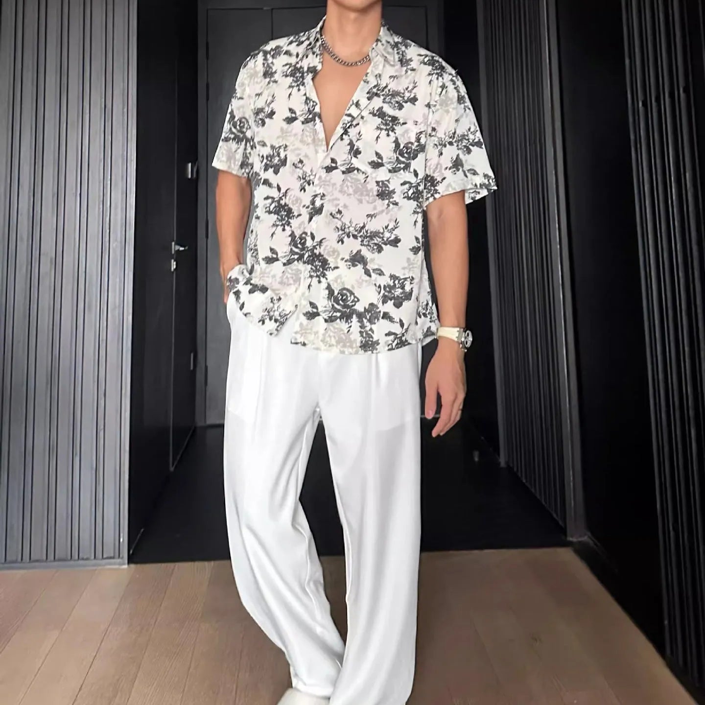 Men's loose black floral printed casual shirt with short sleeves and cardigan style