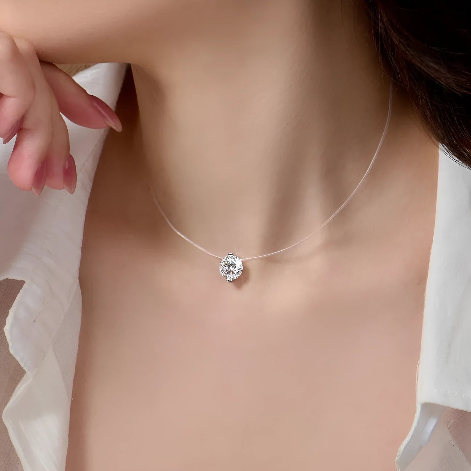Women's S925 silver necklace with a floating moissanite plum blossom pendant on an invisible fishing line chain.