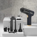 Black wireless handheld car vacuum cleaner with tyre inflation function and multiple attachments