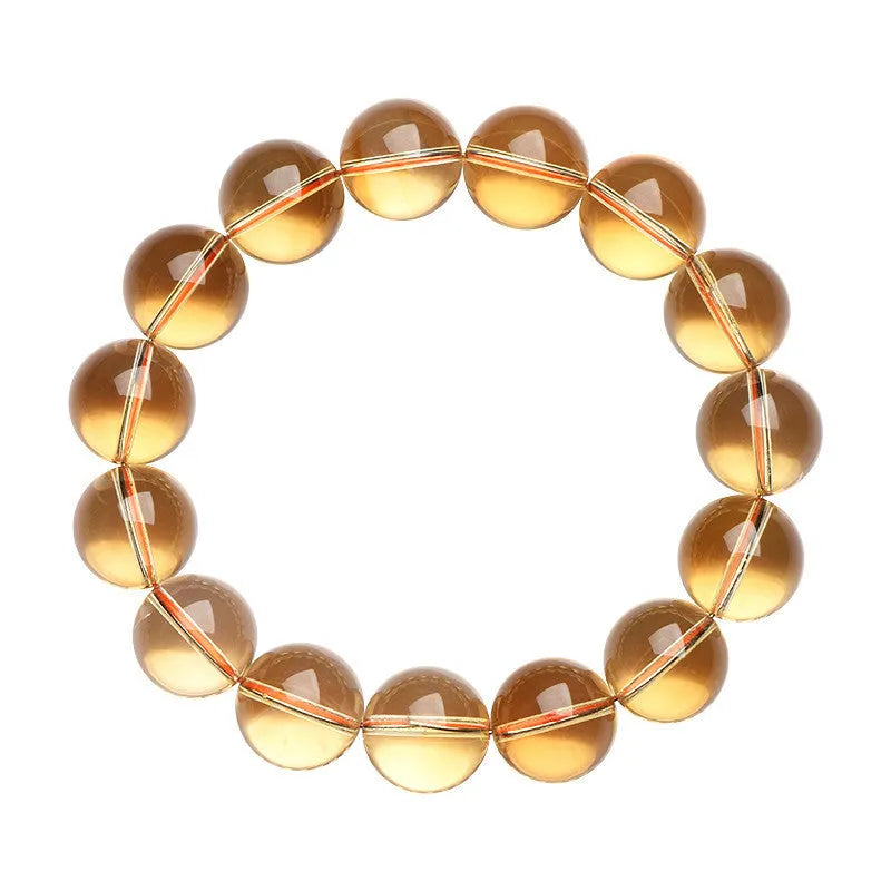 Natural citrine scattered bead bracelet showing polished yellow gemstone beads in an irregular design.