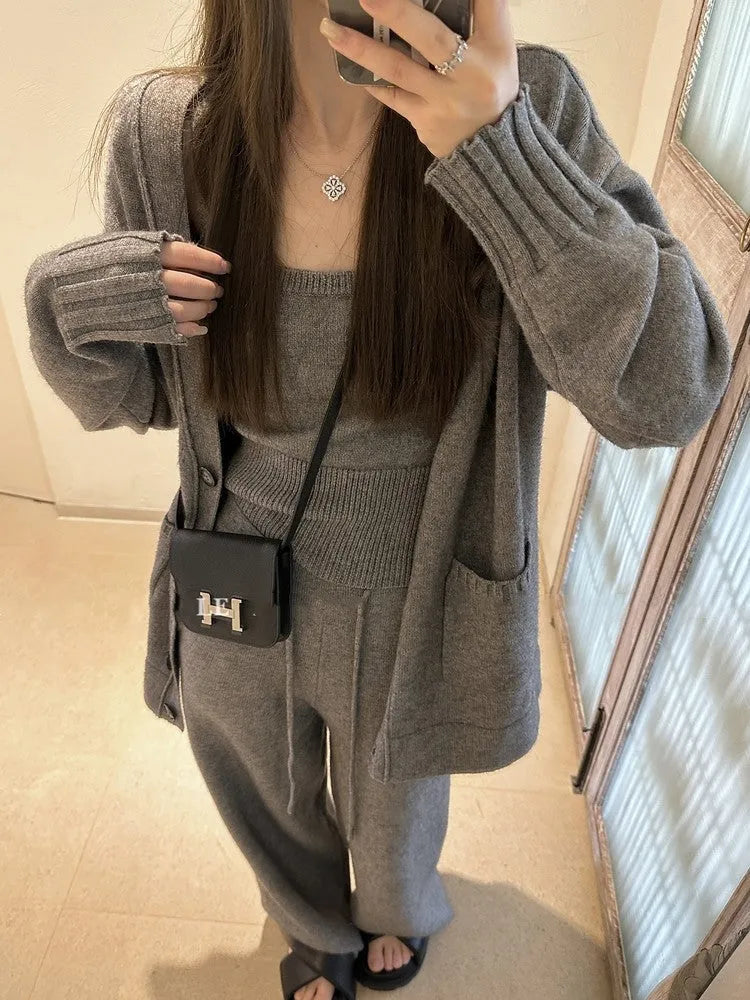 Women's loose fit wool blend cardigan three-piece set in beige, showing vest, coat, and casual pants.