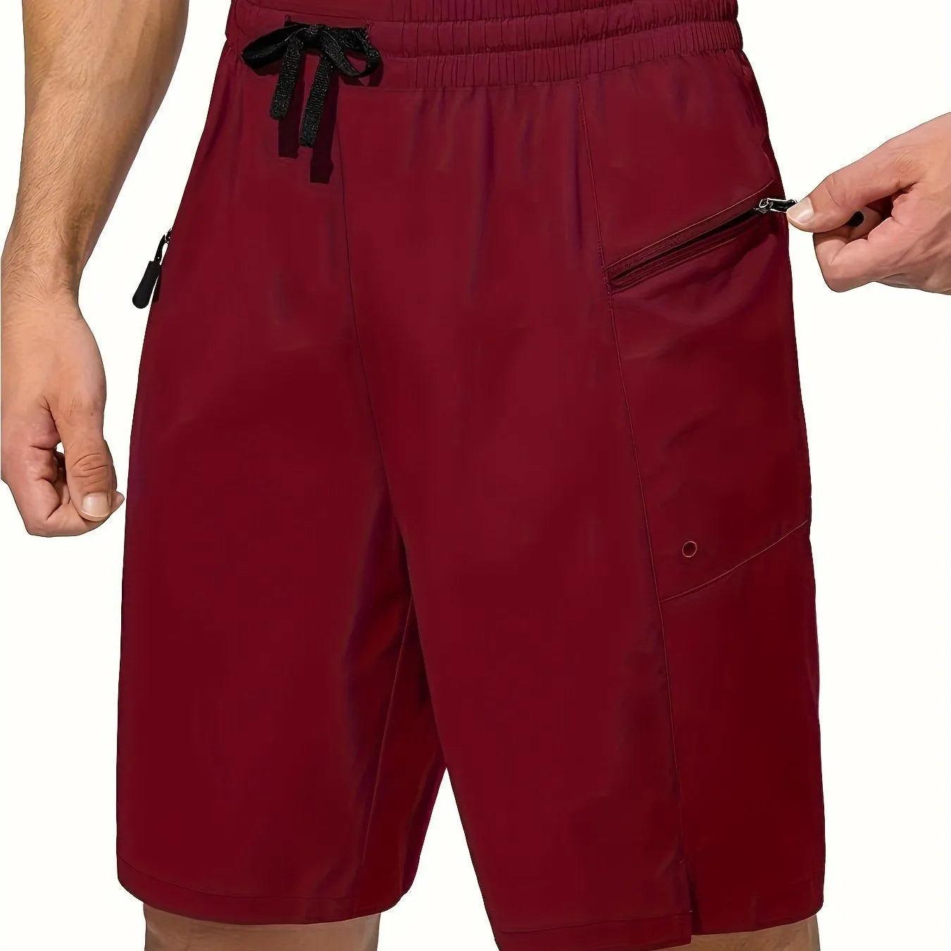 Man wearing straight cut quick-dry polyester beach shorts in a solid colour.