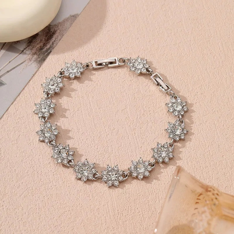 Floral-shaped zinc alloy bracelet with electroplated finish in gold and silver colour options.
