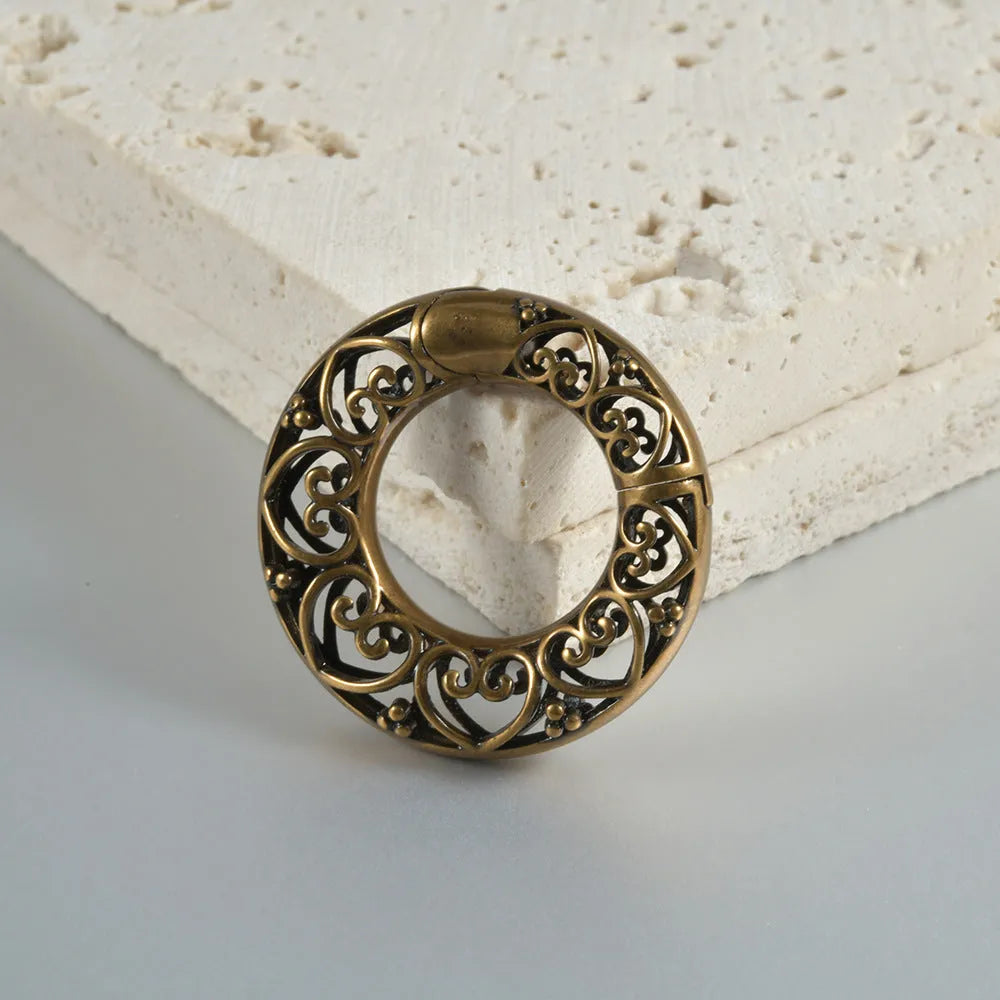 Retro heart-shaped hollow lotus magnetic earrings in stainless steel with antique silver finish