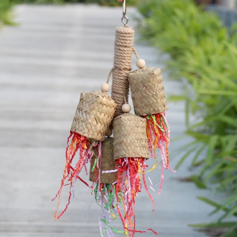 Wood and sisal parrot toy with colourful shredded paper centre for biting and foraging.