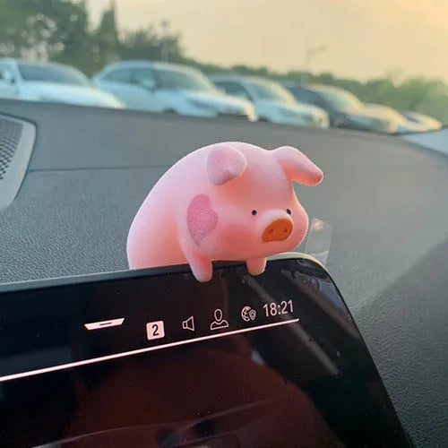 A cute resin cartoon pig figure car accessory for dashboard decoration.
