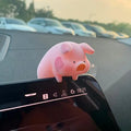 A cute resin cartoon pig figure car accessory for dashboard decoration.