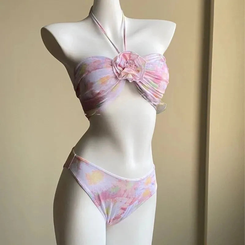 Women's floral split skirt-style swimsuit bikini three-piece set in pink with top, skirt, and panties