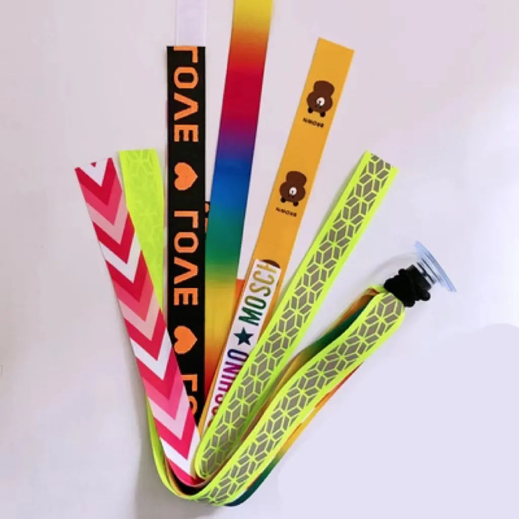 Close-up of a colourful decorative ribbon streamer attached to a child's helmet for roller skating or skiing.