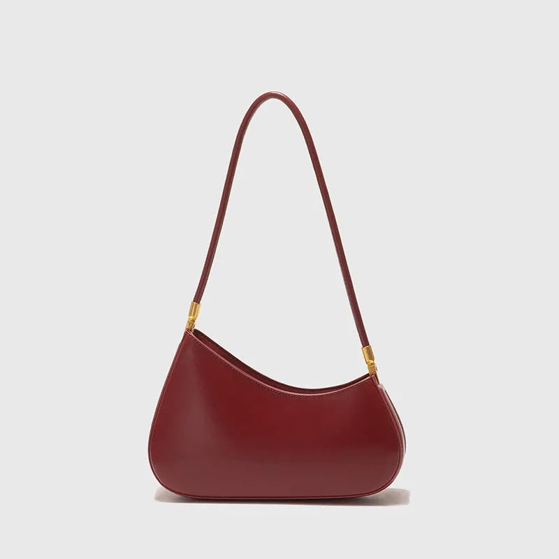 Retro oval women's underarm handbag in multiple colours, showing sandwich pocket design and single shoulder strap.