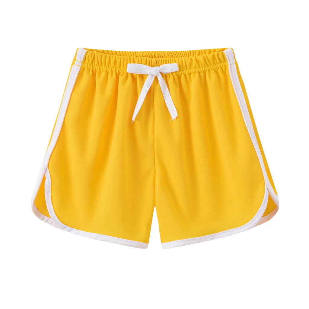 Children's polyester beach shorts in various colours and patterns including stripes, prints and solid options