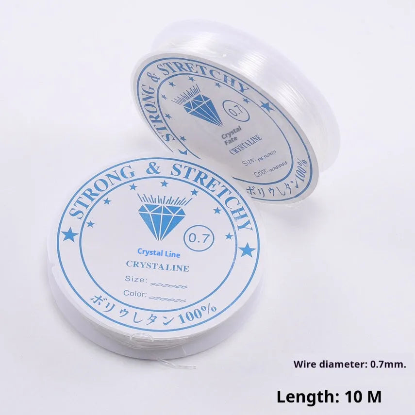 Transparent white elastic fishing line on spool for jewellery making and DIY crafts