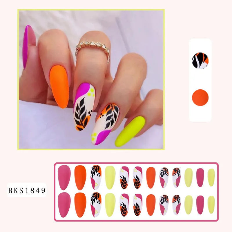 Four boxes of almond shaped nail stickers showing French colourful leaves, colourful plating, star flash macarons, and gradient leopard print designs