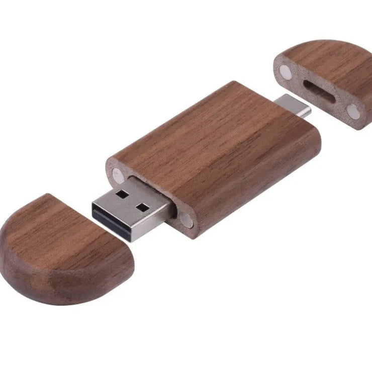 Custom engraved maple wood USB flash drive with Type-C connector for mobile phones on a wooden box.