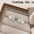 Retro floral fashion earrings in gold or silver colour with petal detailing on copper base.