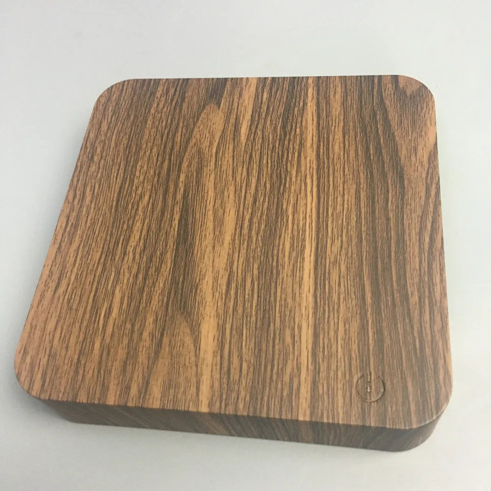 Square walnut coloured magnetic levitation galaxy moon lamp floating above its base