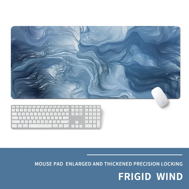 Oversized thick gaming mouse pad with printed e-sports design on a desk with keyboard and mouse.