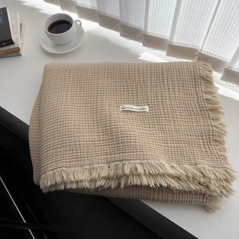 Four-layer gauze cotton blanket with tassel detailing in navy blue colour option