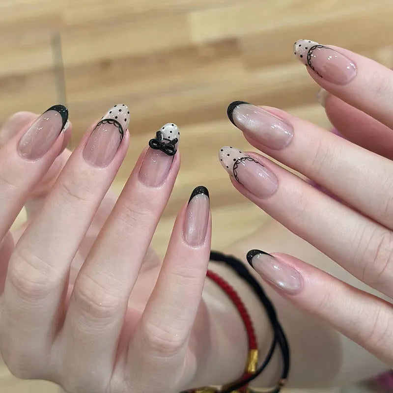 False nails with hand-glued crystal decorations in random mixed colours creating 3D nail art designs