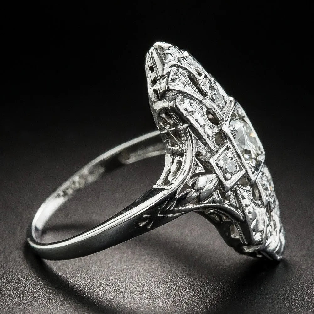 Geometric pattern hollow-out silver plated ring with diamond studs on a copper base.