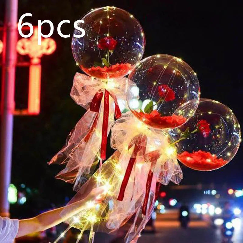 Transparent LED luminous balloon with artificial rose and built-in light, shown as a DIY bouquet kit.
