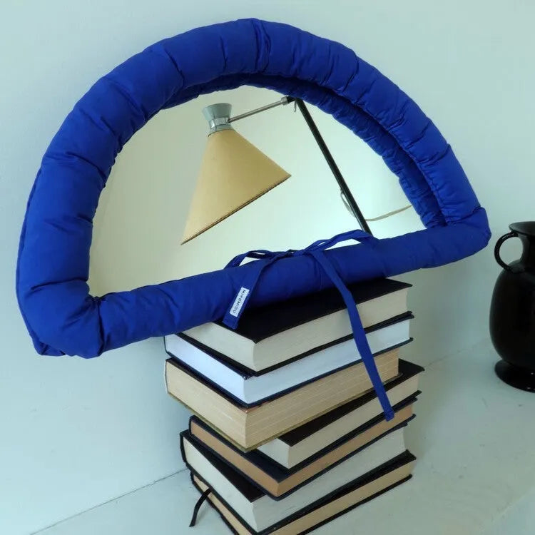 Soft cotton-filled fabric mirror in black, white or sapphire blue colour measuring 23x40cm
