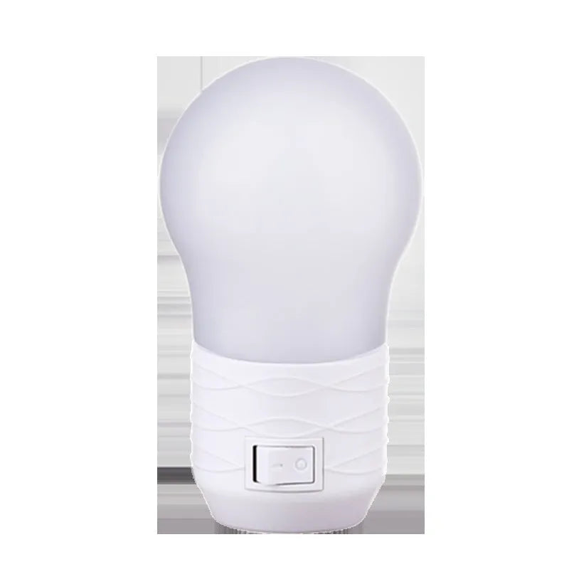 Compact round plug-in bedside baby lamp in white, blue or pink with white or warm light options