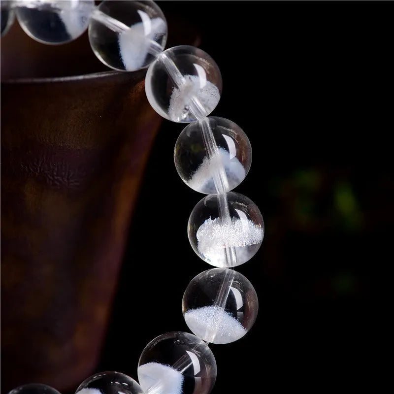 Women's white crystal pyramid bracelet with traditional Ruyi element design showing multiple bead sizes