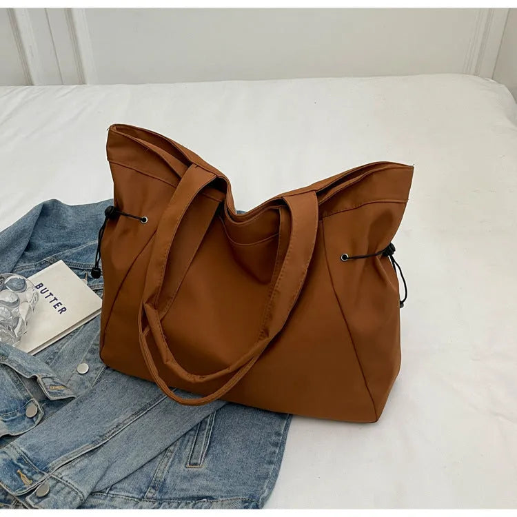 Soft Oxford cloth folding shoulder tote bag shown in available colour options