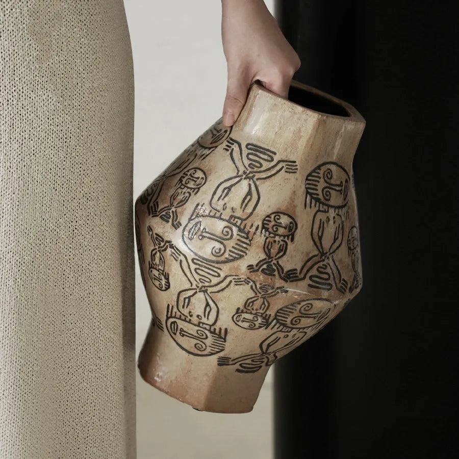 Hand-painted ceramic vase with vintage carved religious patterns in tribal totem colours