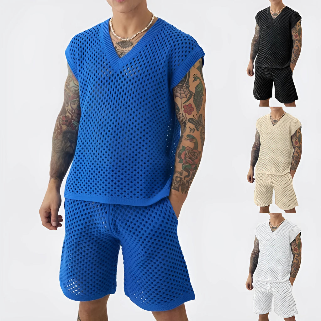 Man wearing a blue sleeveless vest and matching shorts from a men's cotton-blend sports suit set.