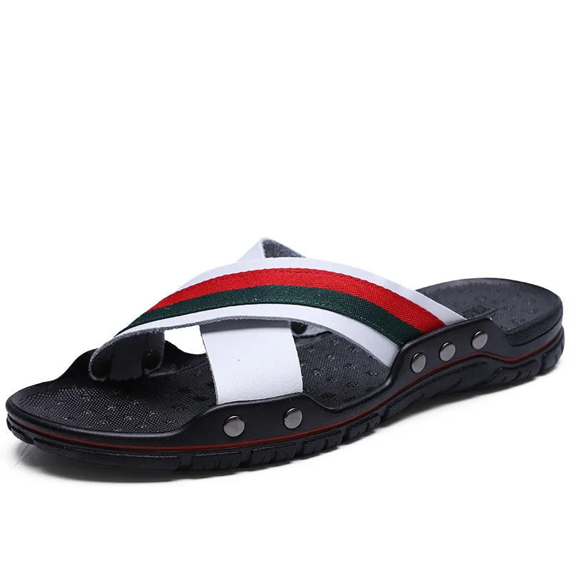 Men's white cowhide leather flip-flop sandals with a non-slip PU sole on a beach background.
