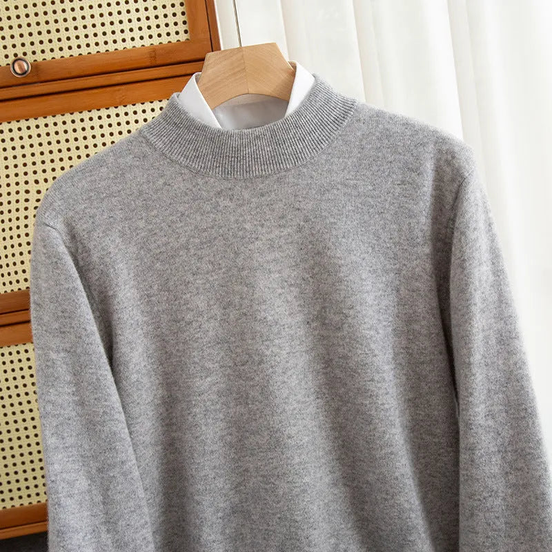 Man wearing a loose-fit half-collar wool sweater in a textured knit, shown in one of the available colours like camel or dark grey.