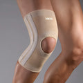 Nylon thick knee pad in skin colour on white background with M L XL size labels