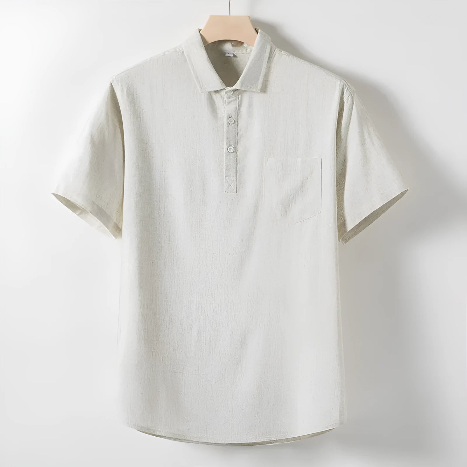 Man's loose-fit linen blend T-shirt in black, shown in a casual setting.
