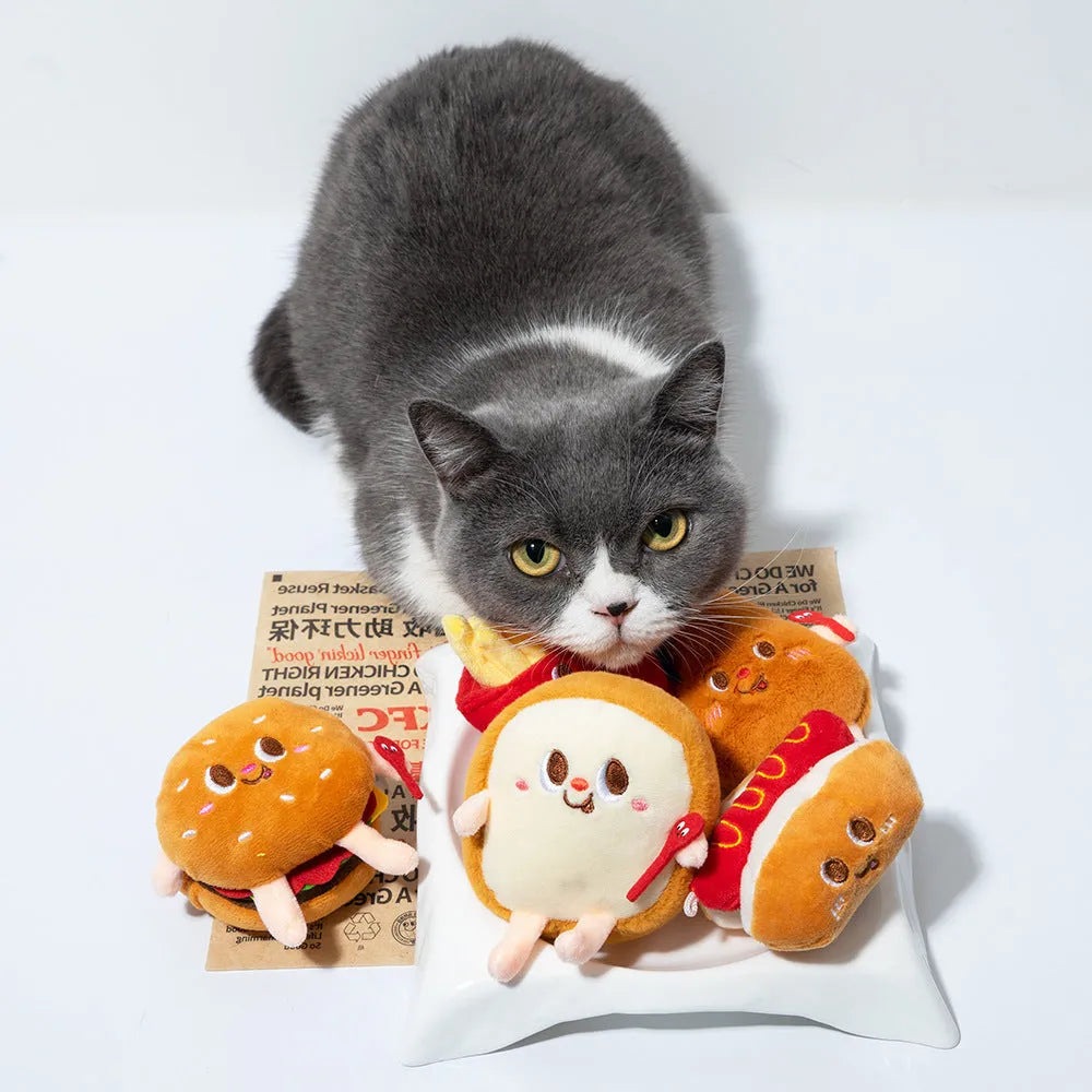 Set of five plush cat chew toys shaped like a hamburger, chicken leg, fries, bread, and hot dog.