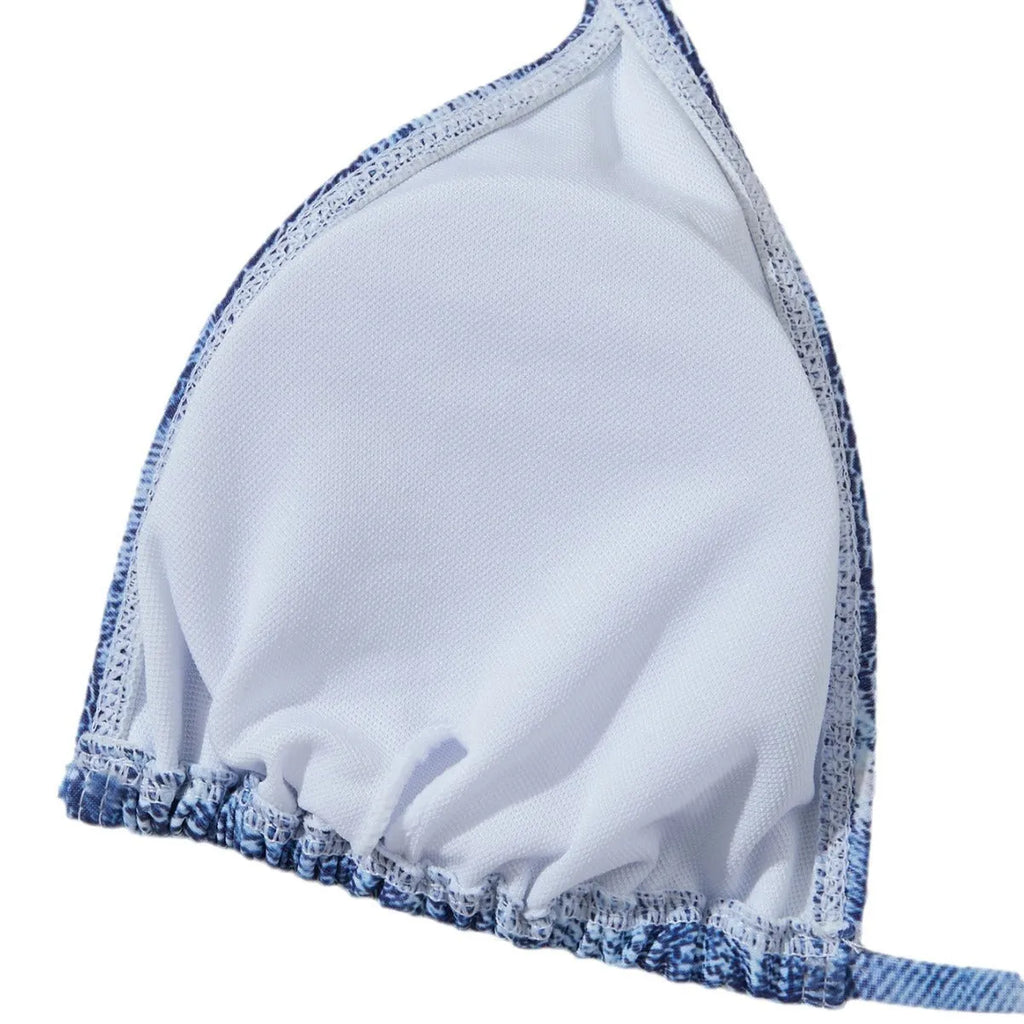 Women's blue denim print strappy bikini set, two-piece swimsuit on a white background.