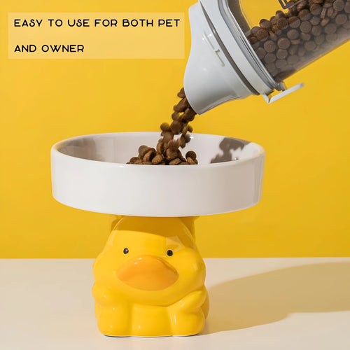 White ceramic raised cat bowl with bear design, showing wide opening and elevated base.