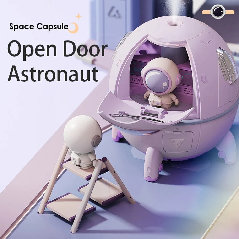 Purple astronaut-shaped USB desktop humidifier with LED light on wooden desk