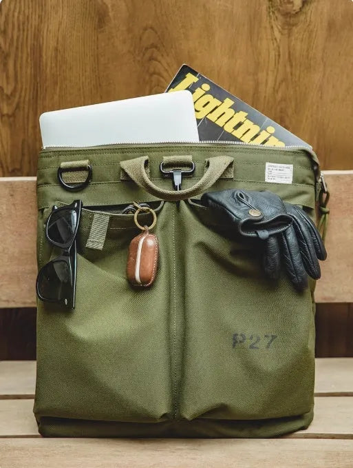 Medium vertical square canvas crossbody messenger bag in military green with shoulder strap
