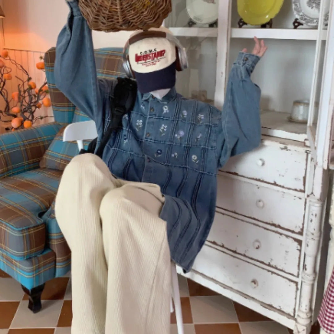 Vintage small floral pleated washed denim long sleeved blue shirt on hanger