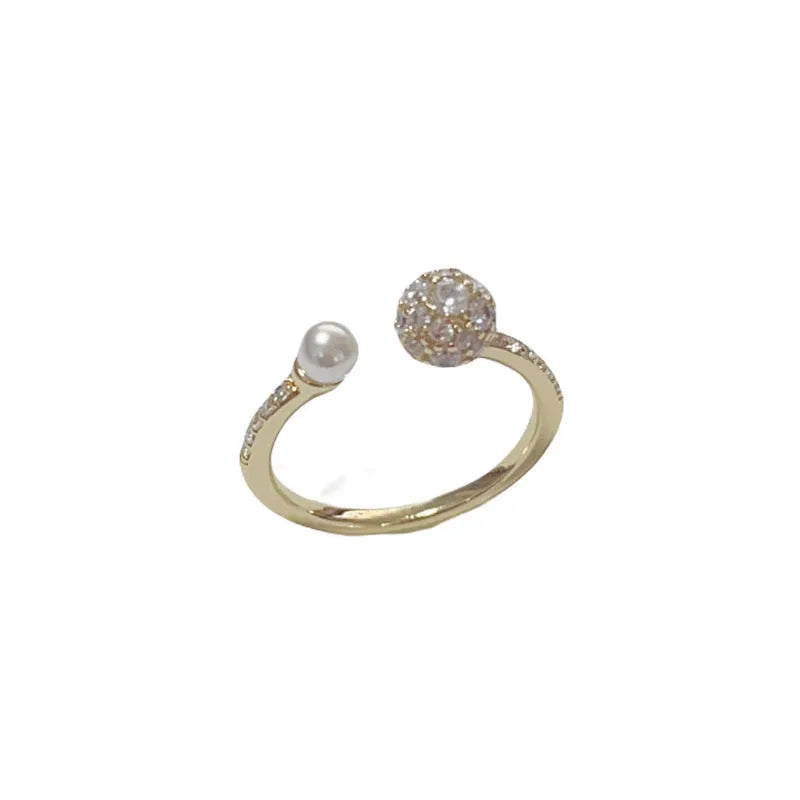 Women's open-end ring with round zircon stones and gold plating on geometric copper band