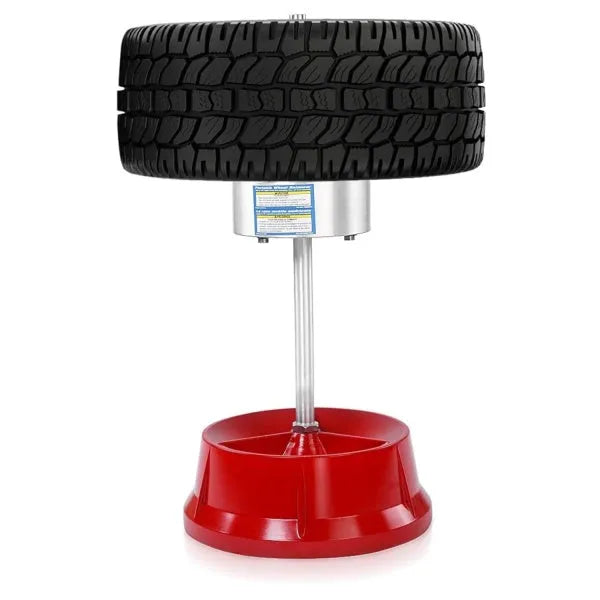 Portable aluminium hub balancer with enamel base for wheel balancing.